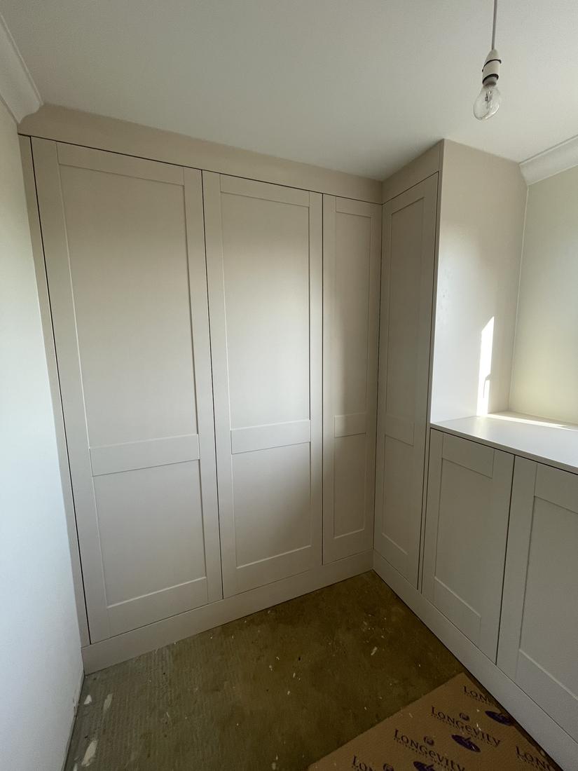 Cream shaker floor-to-ceiling wardrobes